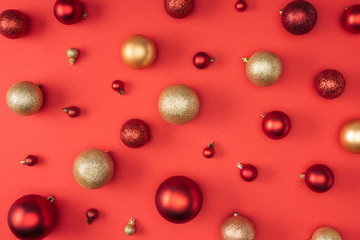 top view of red and golden decorative christmas balls isolated on red