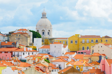 View to Lisbon houses with roofs covered with red tile and National Pantheon (Panteao Nacional or Santa Engracia Church).