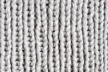 Texture of light grey knitted fabric