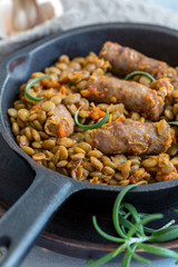 Spicy lentils with rosemary and sausages.