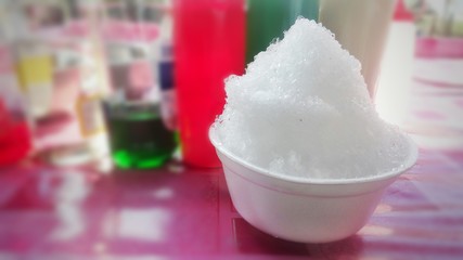 White icing on a blurred background.