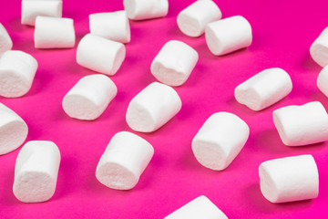 marshmallows on a pink background. top view