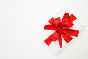 single gift box with red ribbon