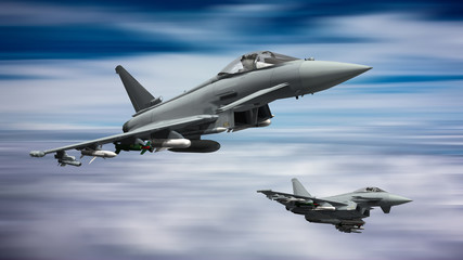 Fototapeta na wymiar armed military fighter jets flying on the speed 
