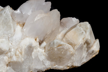 Macro mineral stone Snow quartz with calcite on a black background