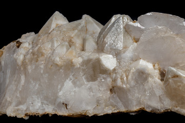 Macro mineral stone Snow quartz with calcite on a black background