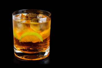 Cold alcohol drink with lime slice