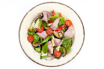 Fresh salad with ham, red pepper, eggplant and basil leaves
