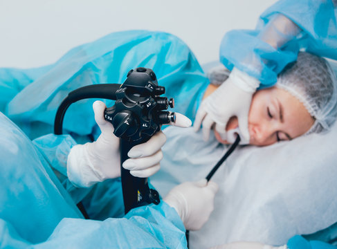 Endoscopy at the hospital. Doctor holding endoscope before gastroscopy