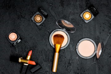 decorative cosmetics nude on dark background top view