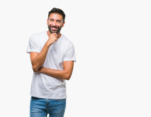 Fototapeta premium Adult hispanic man over isolated background looking confident at the camera with smile with crossed arms and hand raised on chin. Thinking positive.