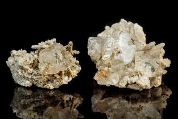 Macro mineral stone fluorite with quartz against black background