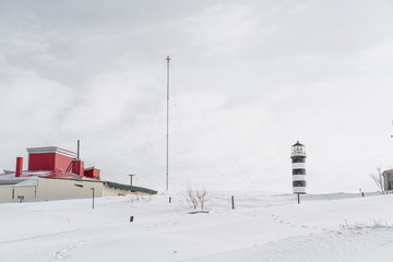 Lighthouse and fisherman willage at west coast of the Pacific ocean