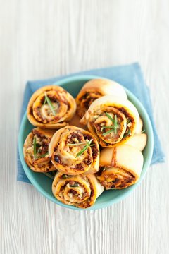 Savoury buns with dried tomatoes, courgette and mozzarella
