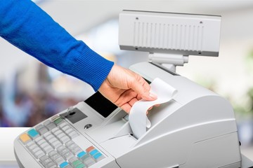 Male hand holding supermarket check close-up view