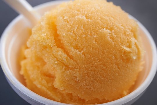 A scoop of mango ice cream (Sorbetto, Italy)