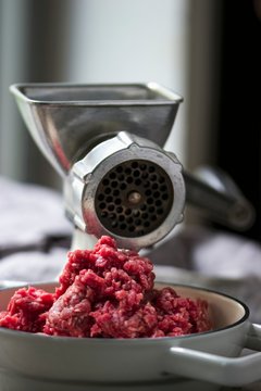 Freshly minced meat with mincing machine