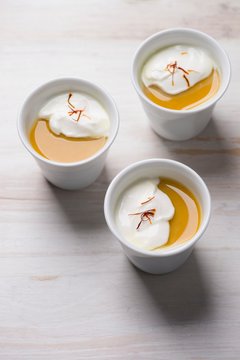 Turmeric panna cotta with coconut cream and saffron