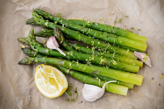 Close up of asparagus salad with lemon slice