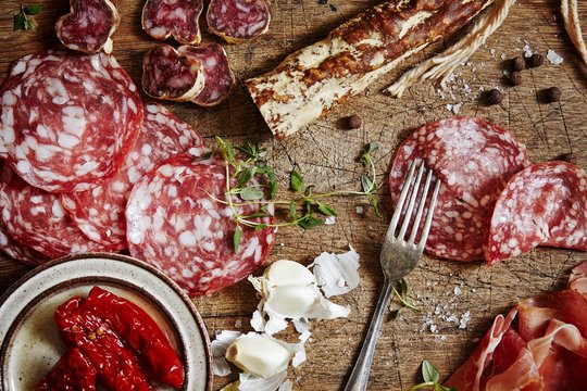 Meat slices on cutting board
