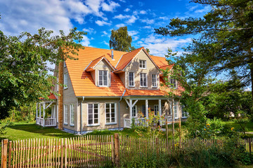 Wooden house with wooden fence on the island Hiddensee.