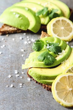 Avocado sandwich on dark rye bread made with fresh sliced avocados from above