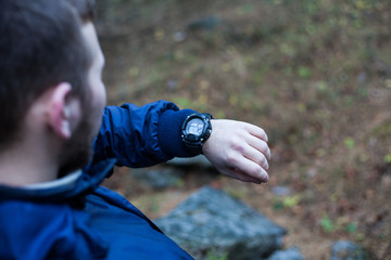 Fototapeta premium Man looking at his watch 