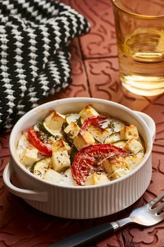 Bulgur wheat bake with zucchini, tomatoes and sheep's cheese