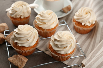 Tasty cupcakes on grey table
