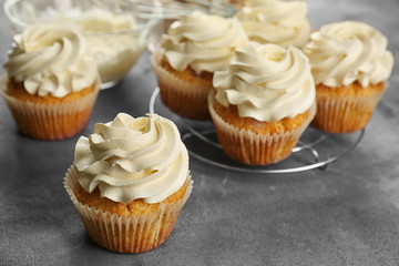 Delicious cupcakes on grey table, closeup