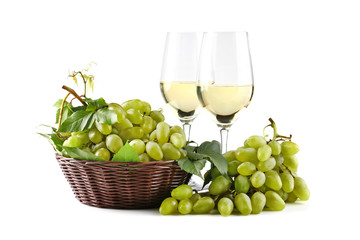 Composition with tasty wine and fresh grapes on white background