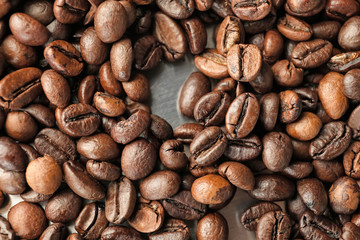 Roasted coffee beans on metal surface