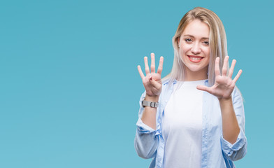 Young blonde woman over isolated background showing and pointing up with fingers number nine while...