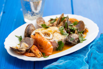 boiled fish with seafood on dish