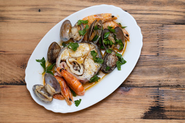 boiled fish with seafood on dish