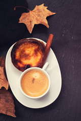 a cup of coffee with typical portuguese egg tart