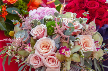 Bouquet of pink roses and other flowers.