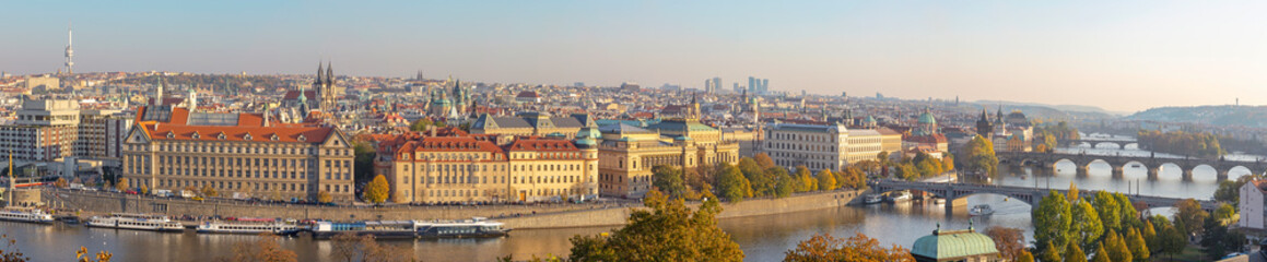 Fototapeta na wymiar Prague - The panorama of the city with the bridges in evening light.