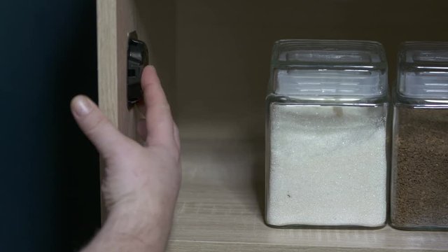 Using cockroach killing baits to kill roaches in the kitchen. Placing plastic bait stations.