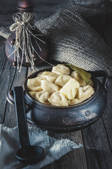 pelmeni Russian national Ukrainian dish in a clay pot