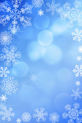 Christmas abstract winter shiny snow bokeh background with unique snowflakes