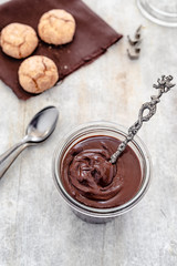 homemade vegan chocolate cream with almond butter, cocoa, sugar, rum, amaretti biscuit (italian almond biscuit)