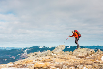 The climber on the top of the mountain.