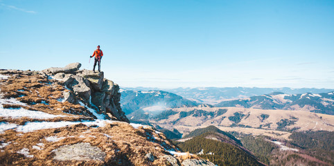 The man on the top of the mountain.