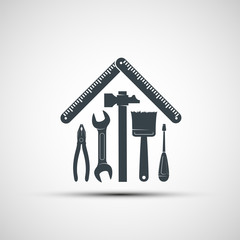 Logo building hand tools like a house. Repair icon.