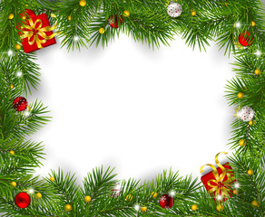 Frame of fir branches decorated with baubles  and gifts on white background. Christmas background with space for text.