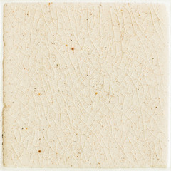 background and texture of stretch marks cracked on white cream glazed tile