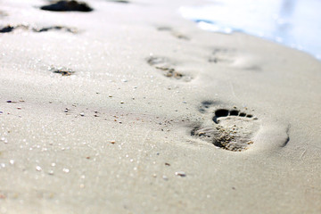 footprints in the sand close upp