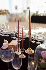Sparkling glassware stands on table prepared for wedding. Wedding decor, interior. Festive. Banquet table. Wedding decor, interior. Festive. Banquet table