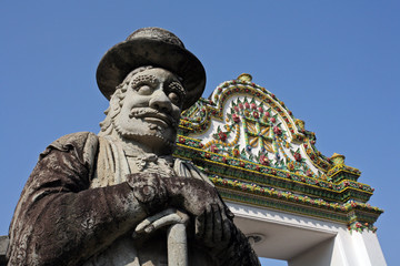 Fototapeta na wymiar Statue and external decoration in Wat Phra Kaew temple complex, Royal Palace, Bangkok, Thailand